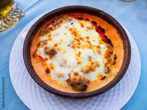 Lasagna bolognese served in a bowl at a spanish restaurant