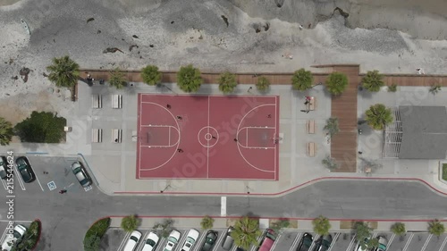 Pull out Drone shot over head a basketball court photo