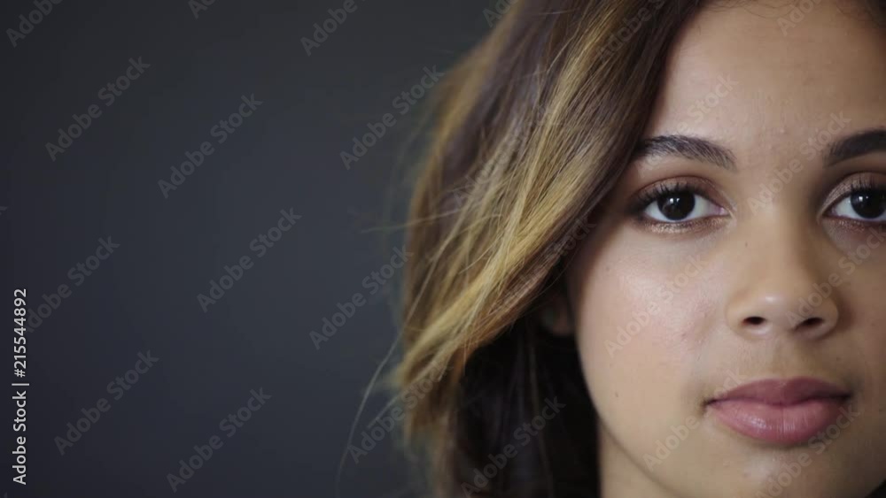 portrait of beautiful young hispanic woman looking pensive at camera cute female student copy space background portrait of beautiful young hispanic woman looking pensive at camera cute female student copy space background