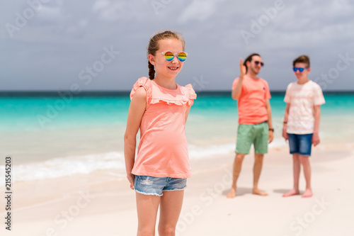 Father with kids at beach
