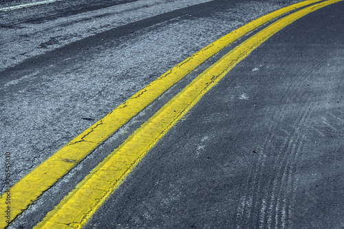 asphalt road with double yellow line