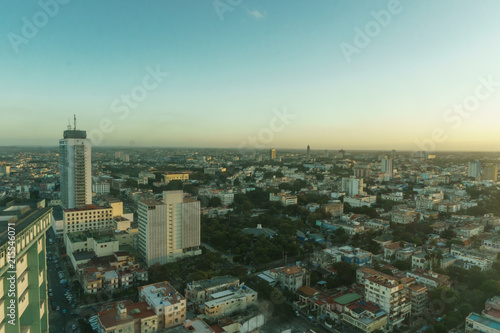 beautiful aerial view of sunrise over a city full of buildings near the beach