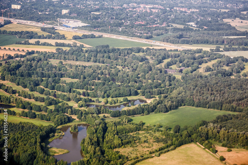 Aerial top view of forest, lake, road and city near Kiev, Ukraine