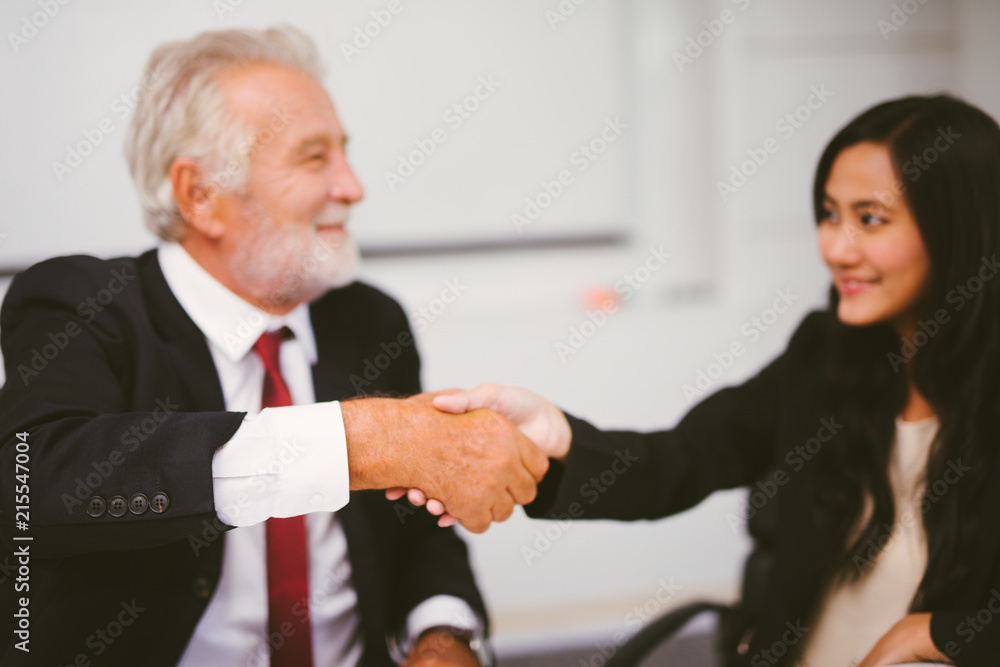Business people partnership handshake concept.Photo two businessman handshaking process.Successful deal after great meeting. blurred background