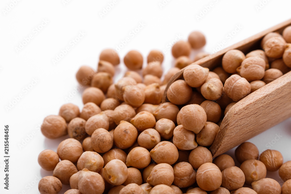 uncooked chickpeas on a white acrylic background uncooked chickpeas on a white acrylic background