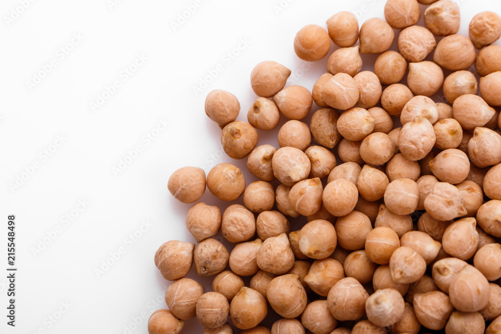 uncooked chickpeas on a white acrylic background uncooked chickpeas on a white acrylic background
