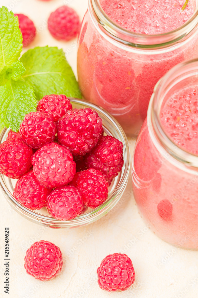 Raspberry smoothie close up macro photography - top view of fresh summer blended cocktail and ripe pink berries. Raspberry smoothie close up macro photography - top view of fresh summer blended cocktail and ripe pink berries.
