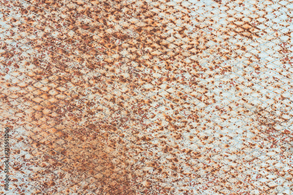 Old, rusty and white, metal plate with diamond shaped no slip grid on it Old, rusty and white, metal plate with diamond shaped no slip grid on it