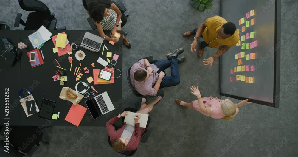 creative multi ethnic business people brainstorming startup business strategy making notes on colorful paper discussing ideas in office workplace collaborating teamwork