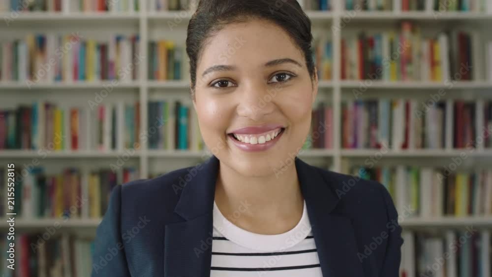 Portrait young woman student smiling bookshelf library university Portrait young woman student smiling bookshelf library university