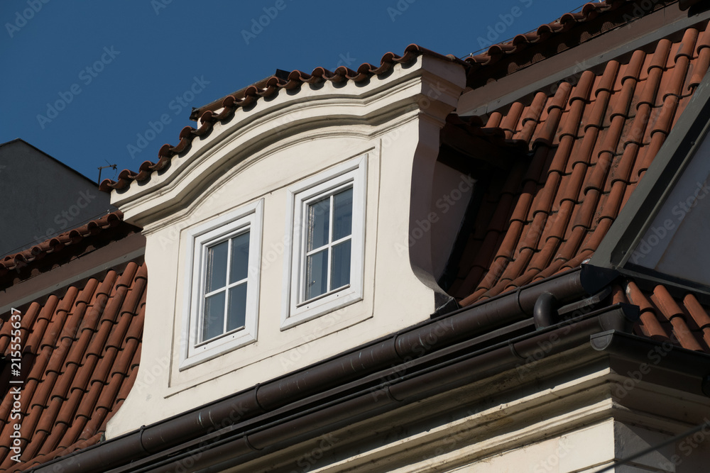 detail of a window on a roof of an old house