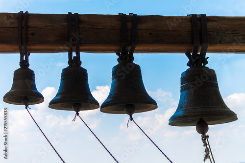 Bronze bells ringing on the tower of the temple.