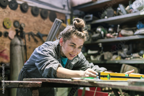 young woman working in workshop photo