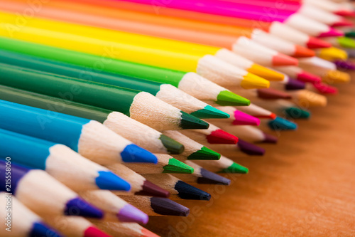 Slika na platnu Many colored pencils on a wooden table