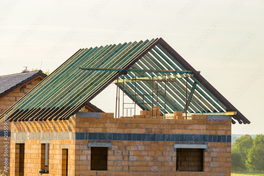 Construction of a house made of bricks, roof repair, new building