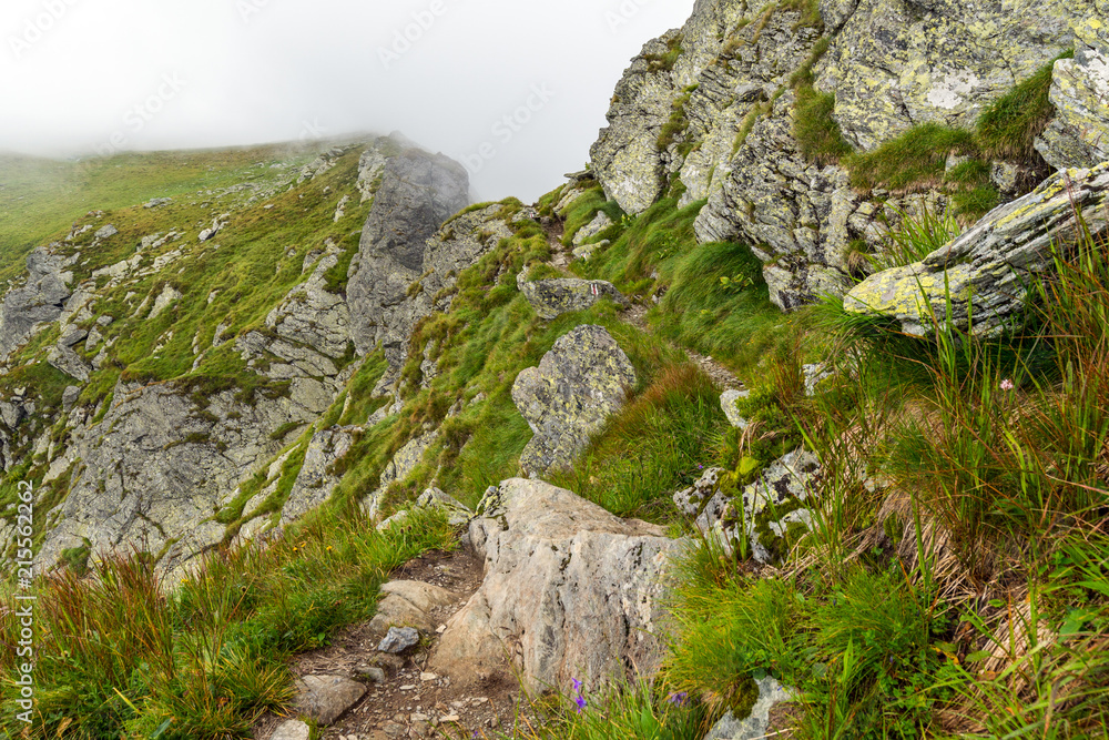 Misty mountains and hiking trail Misty mountains and hiking trail