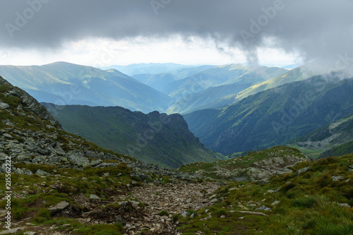 Fototapeta Naklejka Na Ścianę i Meble -  Misty mountains and hiking trail