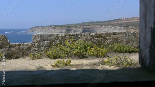 view of the ancient milreu fort now abandoned in Ericeira village, Portugal. photo