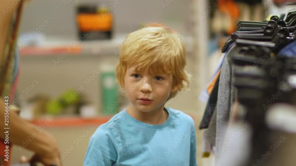 Mother Buys Clothes For Son In The Store Mother Buys Clothes For Son In The Store