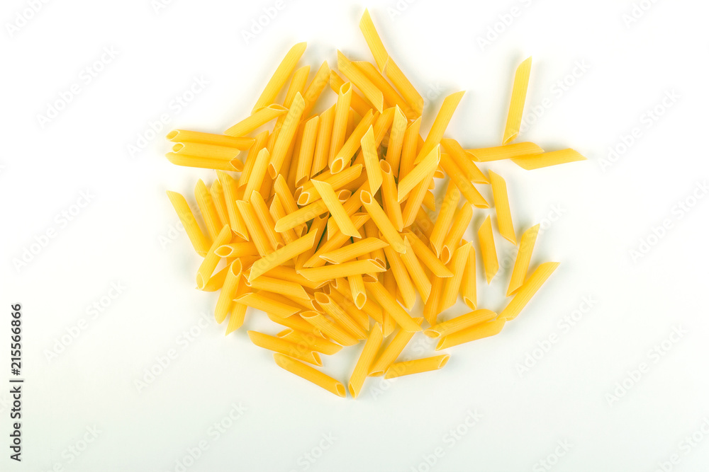 Fototapeta premium Raw italian penne rigate pasta isolated on white background