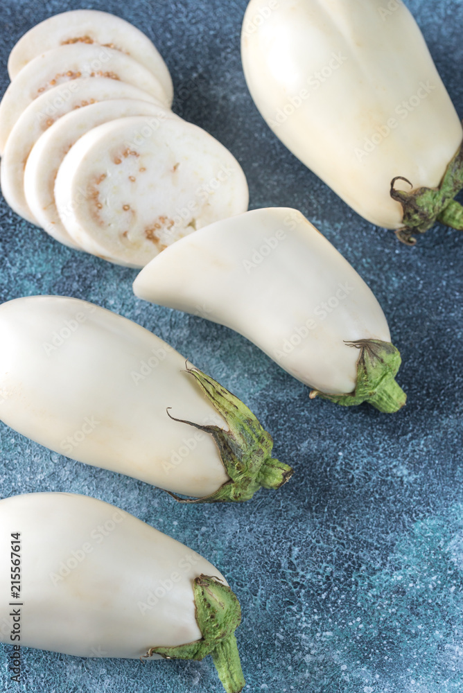 White aubergines on the wooden background White aubergines on the wooden background