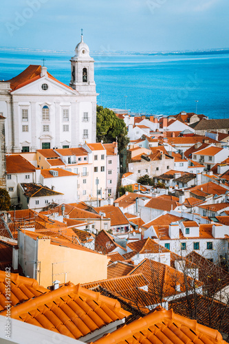 Lisbon, Alfama district with orange roof tiles and white walls, Portugal photo