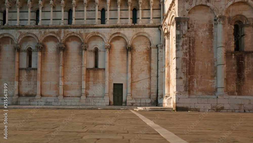 Low angle POV shot of the Piazza San Michele in the Tuscan city of Lucca, Italy. The square is home to San Michele in Foro Church. Lucca is famous for its city walls dating from the Renaissance era Low angle POV shot of the Piazza San Michele in the Tuscan city of Lucca, Italy. The square is home to San Michele in Foro Church. Lucca is famous for its city walls dating from the Renaissance era