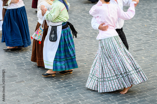 people weared with traditional Portuguese costumes at romeria