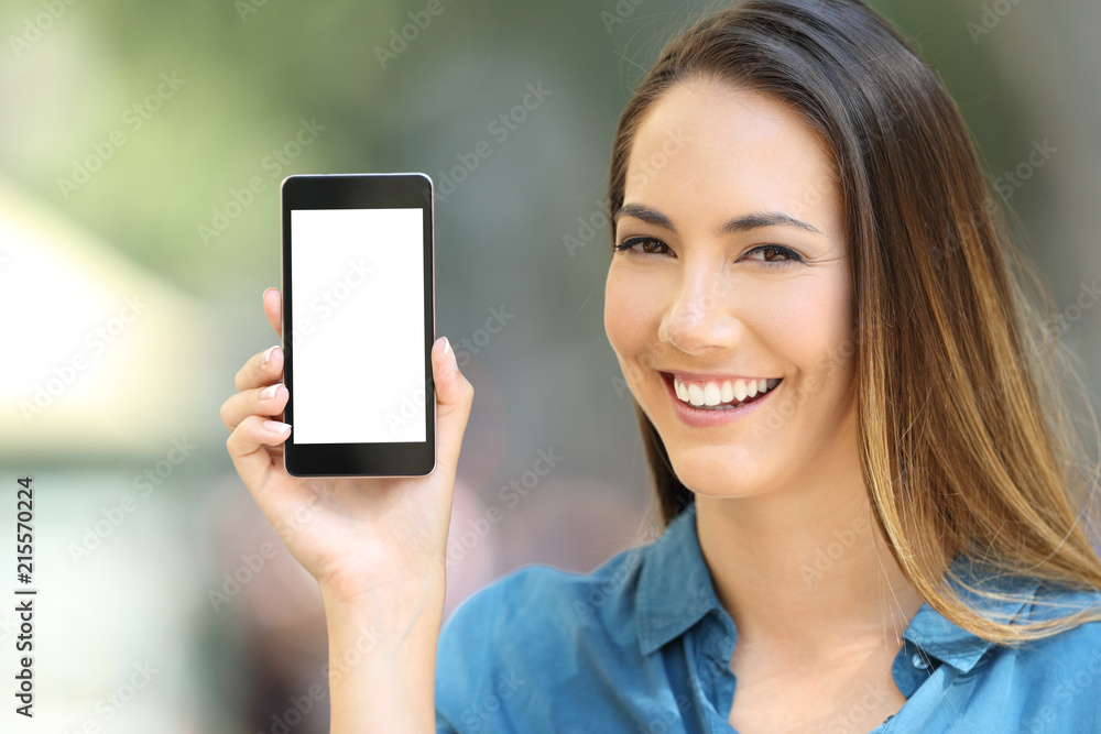 Happy lady showing a blank phone screen mock up Happy lady showing a blank phone screen mock up