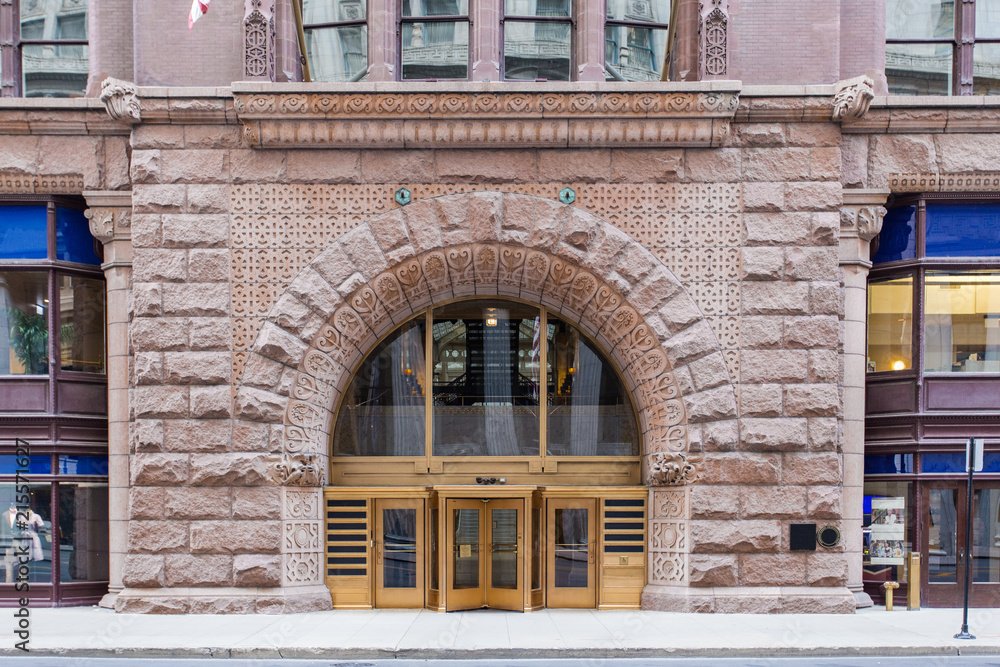 Large brick entrance to a vintage building