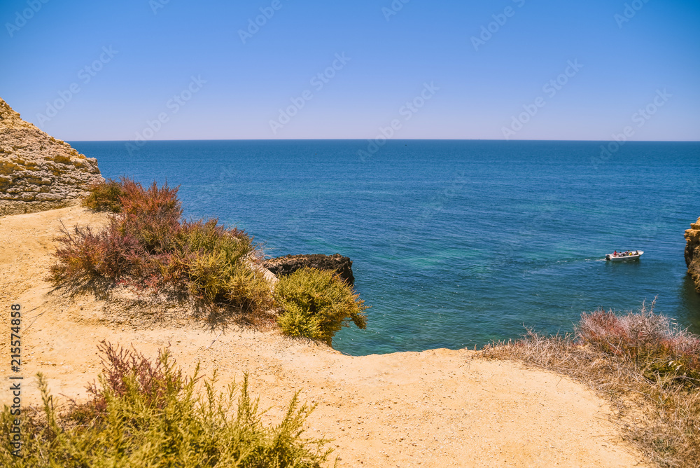 Bright blue sky and sea natural Algarve Portugal outdoors background. Sunny day travel vacation destination panoramic images.