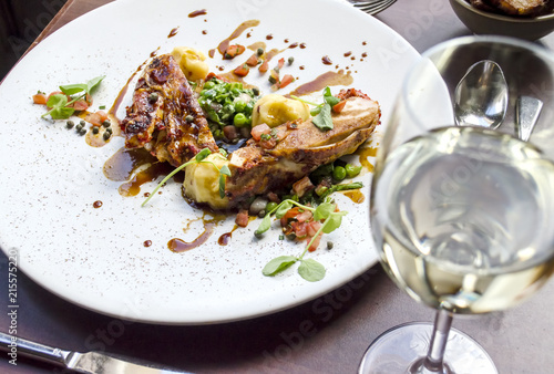 Chicken Dinner and Wine on a Restaurant Table