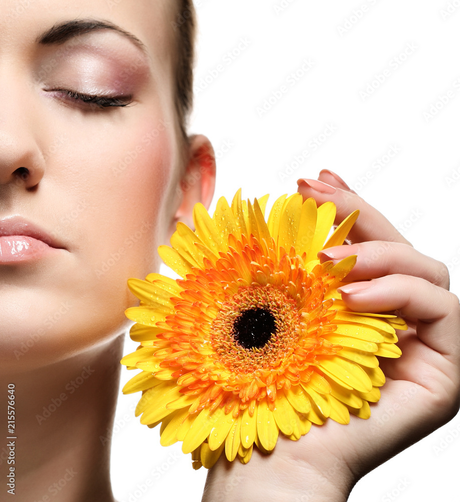 Beautiful young woman with gerber flower