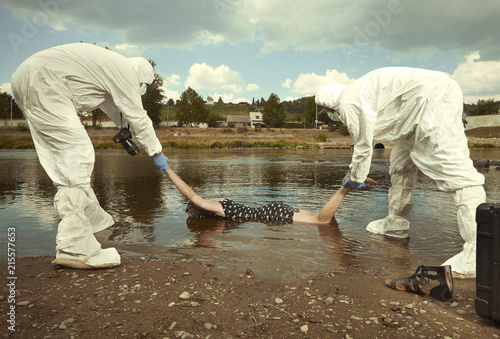 Woman body in black apparel found drowned near summer river bank in city