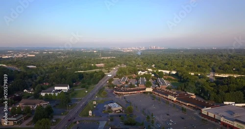 Aerial drone footage over strip mall retail center with Nashville Skyline off in the distance,? photo