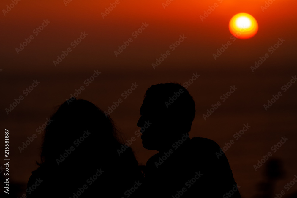Silhouette of a couple of lovers at sunset in the neighborhood of Miraflores (Lima, Peru)