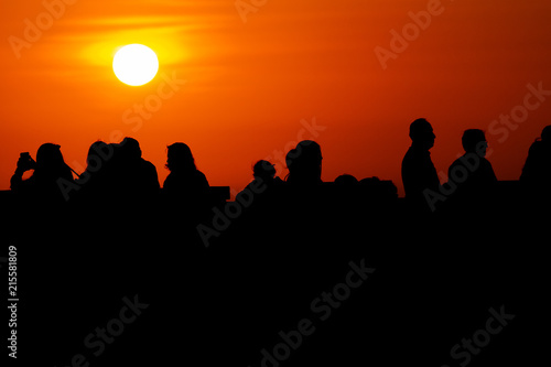 Silhouettes of people at sunset in the neighborhood of Miraflores  Lima  Peru 