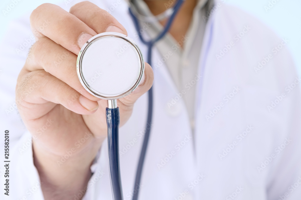 Doctor in white gown uniform with stethoscope in a hospitsl. Doctor in white gown uniform with stethoscope in a hospitsl.