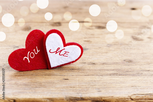 Red Heart of Truly love concept on rustic wooden table with light bokeh and copy space. Valentine day, wedding celebration. You and Me love forever concept. 