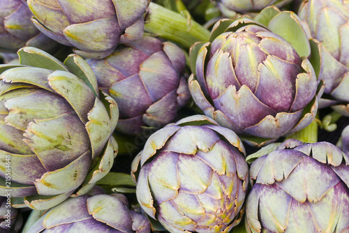 Healthy purple artichokes creating an over all background