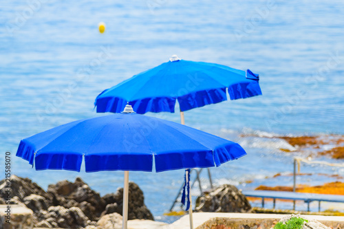 Fototapeta Naklejka Na Ścianę i Meble -  Sketches with beach umbrellas at Cape Martin. Cote d'Azur. France