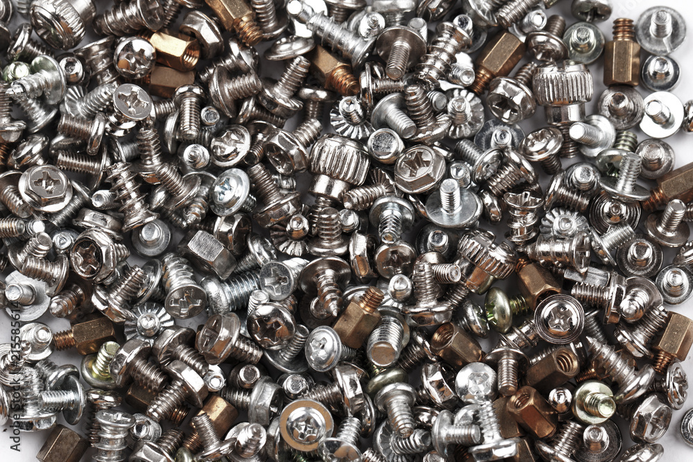 Background of many randomly scattered screws Background of many randomly scattered screws