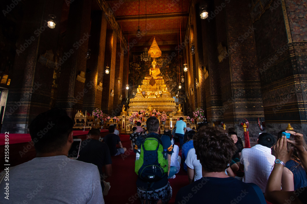 Bangkok, Thailand - Jul 9, 2018: Wat Pho or Wat Phra Chetuphon buddhist temple . golden buddha statue . old historic architecture . foreigner traveller go pray and worship .