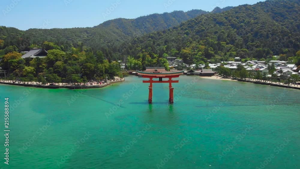 Aerial Drone dramatically approaching from Itsukushima Shrine at Miyajima, Hiroshima, Japan. Aerial Drone dramatically approaching from Itsukushima Shrine at Miyajima, Hiroshima, Japan.