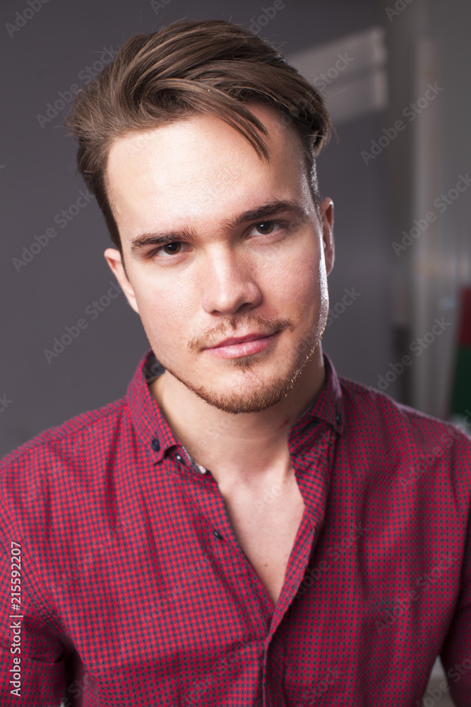 Studio portrait of young man on a dark background Studio portrait of young man on a dark background