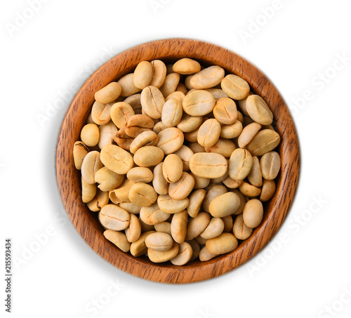 Raw coffee beans in wood bowl