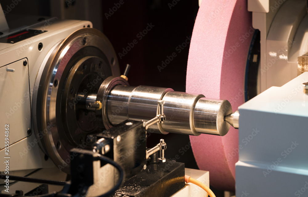 Fototapeta premium operator grinding mold and die part by universal grining machine in factory_01