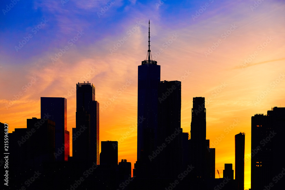 New York City skyline silhouette at sunset, USA.