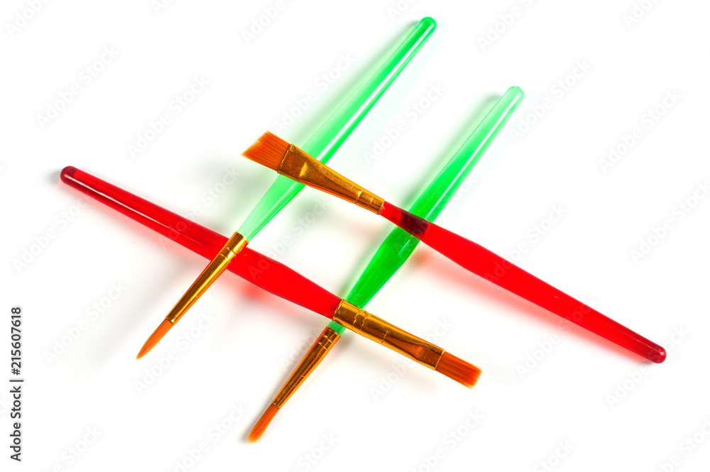 Paint brushes of various shapes and widths with bright plastic handles Paint brushes of various shapes and widths with bright plastic handles