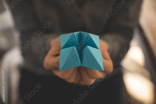 Women showing origami at home photo